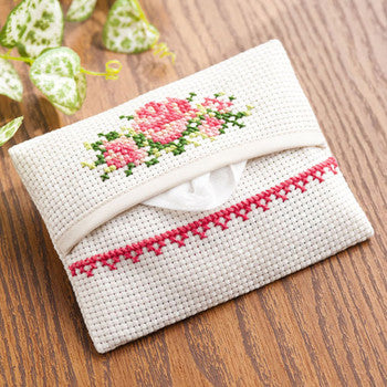 A Cosmo Japan Tissue Pouch Kit showing the pre-sewn cream fabric pouch with a 14-count Aida stitching area and colorful embroidery thread pattern on tissue pouch is english rose.