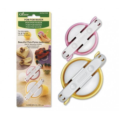 A pair of Small Clover Pom-Pom makers in yellow and pink, designed for creating 35mm and 45mm yarn spheres. The image shows the compact, hinged circular tools open and ready for yarn wrapping, ideal for detailed fiber art accents.