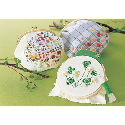 An adjustable Clover punch needle tool for embroidery, ideal for creating textured 3D effects on fabric with standard embroidery floss