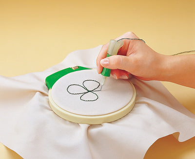 An adjustable Clover punch needle tool for embroidery, ideal for creating textured 3D effects on fabric with standard embroidery floss or fine yarns.