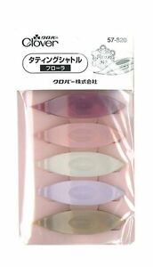 A set of five tatting shuttles in flora series, presented in a packaging that displays the shuttles in a line, showcasing their pastel colors.