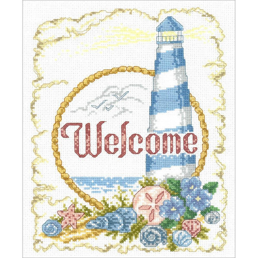 The 'Coastal Welcome' cross-stitch design featuring a tall lighthouse, seagrass, and a calm ocean view with the word Welcome in elegant lettering. Beach house wall decor, ocean themed embroidery, full DMC cross stitch kit, lighthouse lover gift, summer needlework projects