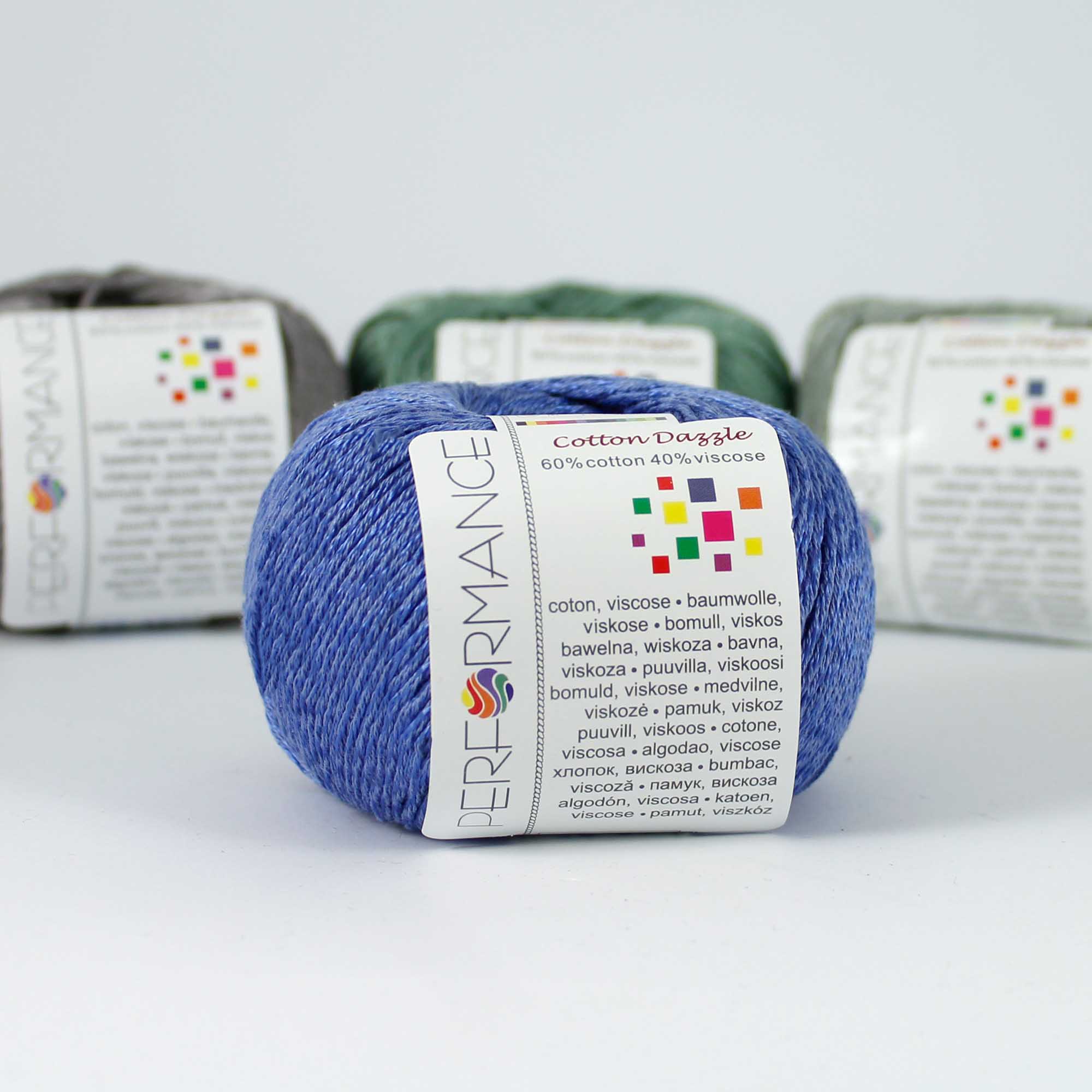 A 50g skein of Cotton Dazzle yarn in a vibrant shade, showcasing the subtle reflective shimmer and smooth plied texture of the cotton-viscose blend in baby blue colour
