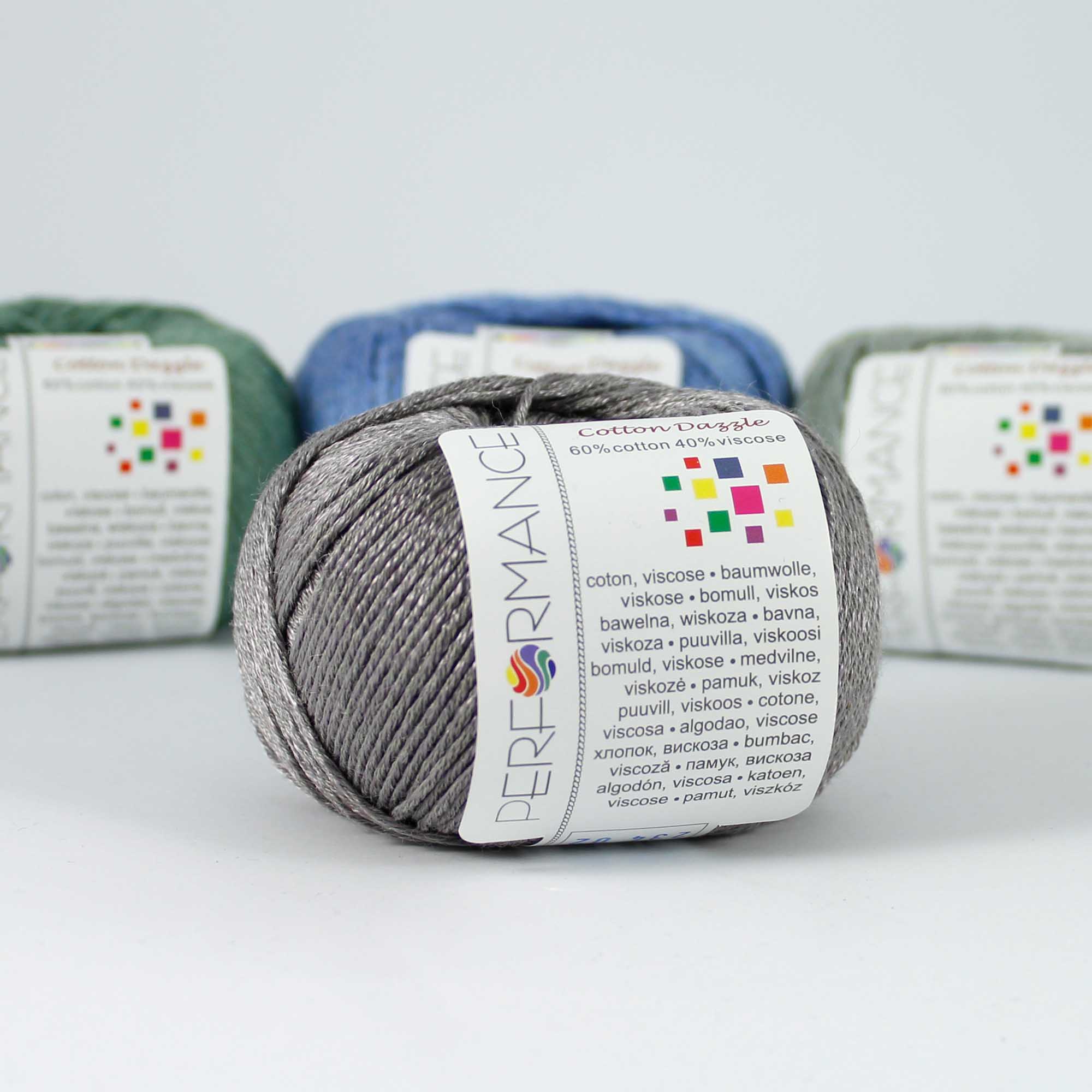 A 50g skein of Cotton Dazzle yarn in a vibrant shade, showcasing the subtle reflective shimmer and smooth plied texture of the cotton-viscose blend in silver grey colour