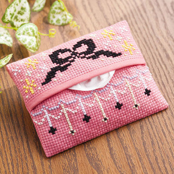 Close-up of the ready-made pouch construction, highlighting the clean stitching and the integrated Aida cloth panel featuring a pink tissue pouch with ribbon in a kawaii design.