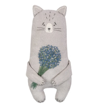 "A finished Aroma  Cat Animal tucked into a drawer of folded linens, highlighting its use as a stylish and fragrant sachet holding to a bouquet embrodiered lavander