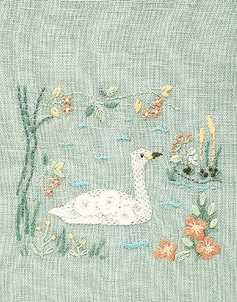 The completed Chicchi animal swan in a lake embroidery, showcasing the professional texture and soft, forest-inspired colors