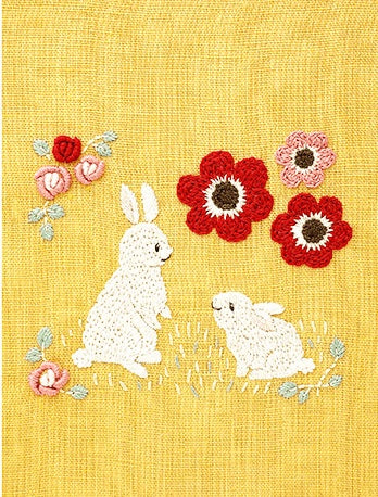 The completed Chicchi animal rabbit with spring flowers embroidery, showcasing the professional texture and soft, forest-inspired colors