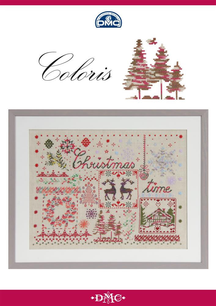 DMC Coloris Christmas Sampler chart booklet showing a large, intricate festive design featuring traditional holiday motifs