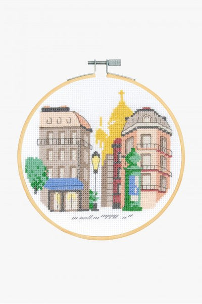Close-up of the DMC Paris embroidery pattern, showcasing the minimalist Parisian skyline and the vibrant, coordinated colors of the included premium embroidery floss.