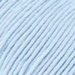 Close-up of DMC Natura Just Cotton yarn, showcasing the natural, unmercerized texture and smooth finish for delicate knitting and crochet in baby blue
