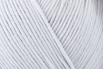 Close-up of DMC Natura Just Cotton yarn, showcasing the natural, unmercerized texture and smooth finish for delicate knitting and crochet in grey colour