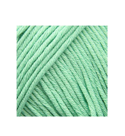 A 50g ball of DMC Natura Just Cotton yarn, showcasing its smooth, matte texture and multi-ply combed cotton fibers. The image highlights the natural, non-mercerized finish and the sophisticated, muted color tones ideal for lightweight garments, amigurumi, and home decor in mint colour
