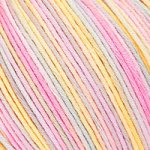 A 50g ball of DMC Natura Multico cotton yarn featuring a soft, matte finish and beautiful variegated color transitions. The image highlights the combed cotton fibers and the multi-ply twist, perfect for lightweight garments, amigurumi, and delicate accessories that require a breathable, high-quality finish