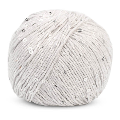 Macro shot of DMC Natura Glam fibers, highlighting the small, flat sequins that are seamlessly integrated into the cotton blend for a subtle sparkle in silver white colour