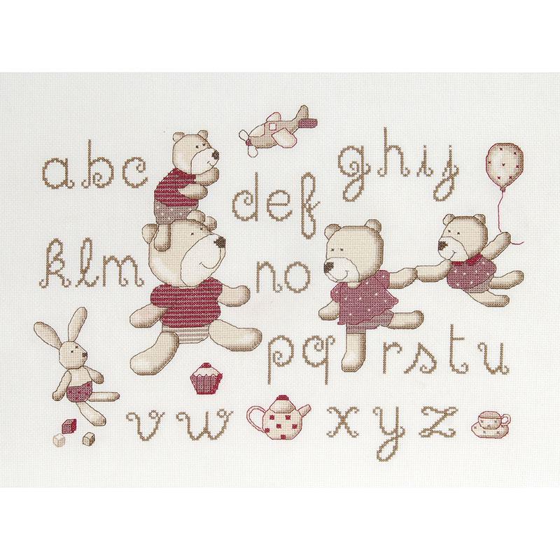 A cross stitch kit depicting a teddy bear and alphabet letters, with a white background and colored text and bears.