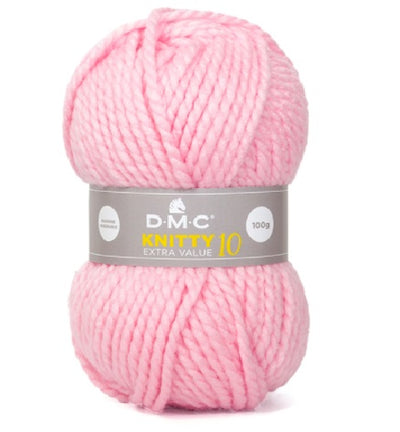 A skein of DMC Knitty 10 Extra Value Yarn in baby pink color with brand label displayed. MC Knitty 10 yarn held alongside a 10mm knitting needle to demonstrate the impressive thickness and quick-stitch potential."