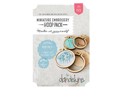 Packaging of Dandelyne Circular Mini Hoop with contents displayed, including miniature embroidery hoops, screws, bolts, backing pieces, and centre plates.