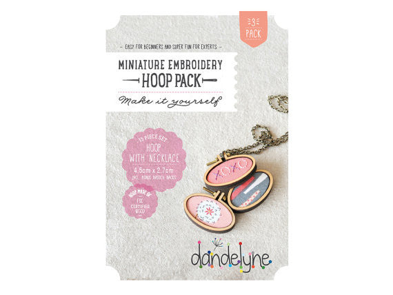 Packaging of Dandelyne Oval Mini embroidery hoop pack containing 3 hoops with attached necklace chains and brooch backs, displayed on a white background.

A set of three Dandelyne oval miniature embroidery hoops (4.5x2.7cm) shown with their specialized mounting hardware and bronze necklace chains