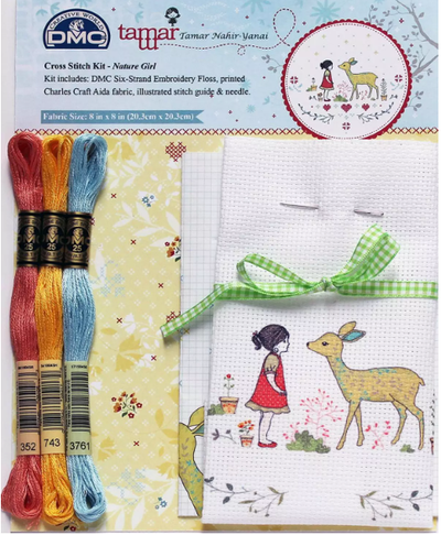 Close-up of the 14-count Aida cloth with the girl and deer image clearly pre-printed, showing the vibrant colors and stitch areas with threads included.