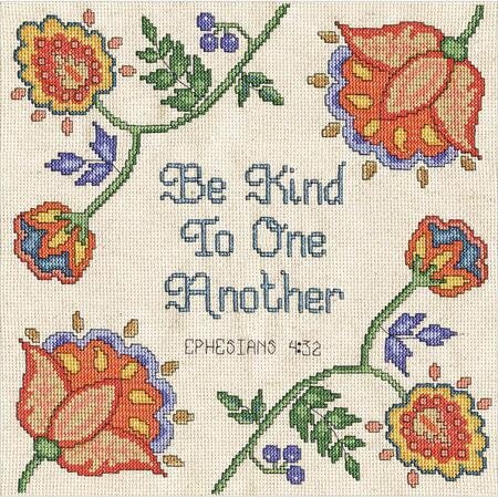 An inspirational Design Works counted cross-stitch kit featuring the Bible verse 'Be Kind To One Another - Ephesians 4:32.' The design is centered on 14-count white Aida fabric, surrounded by a delicate floral or decorative border. The kit includes 100% cotton embroidery threads, a needle, and easy-to-follow instructions for a 10-inch square finished piece