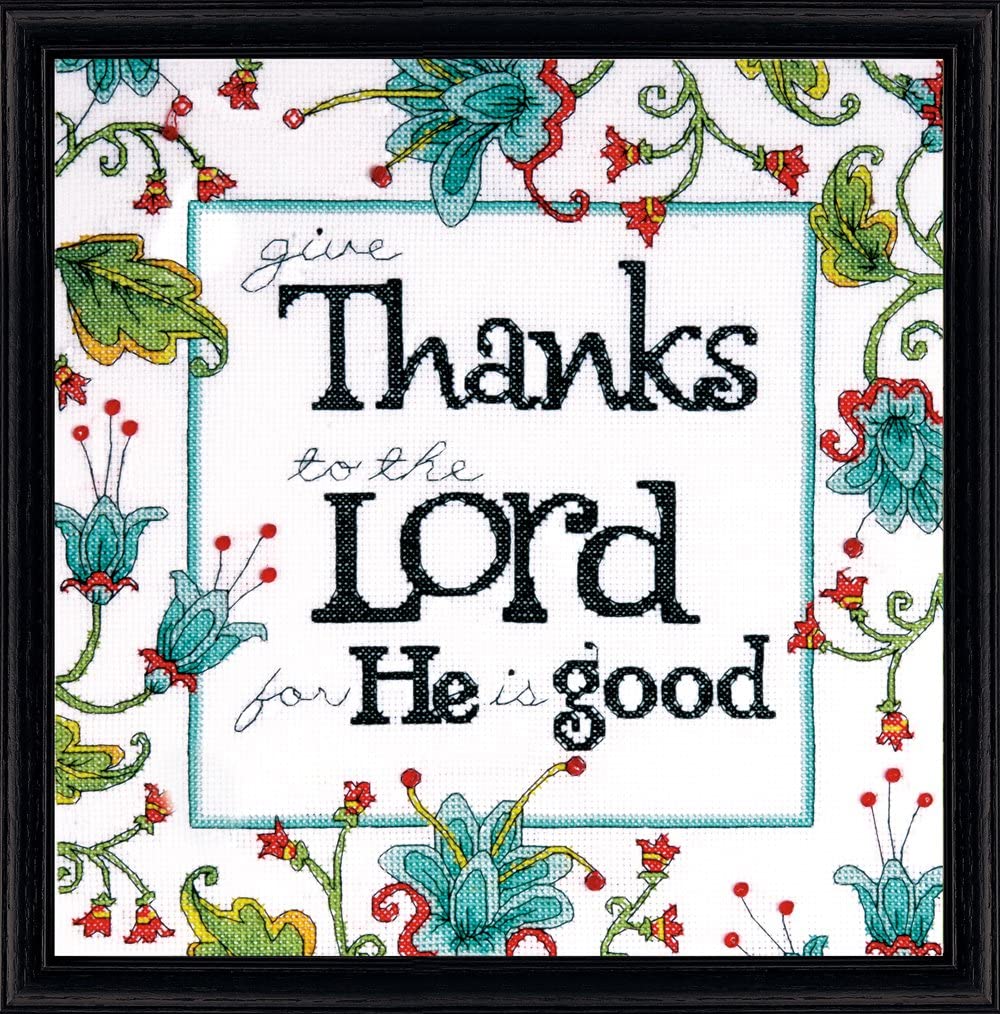 An inspirational Design Works counted cross-stitch kit featuring the sentiment 'Give Thanks.' The design is adorned with decorative motifs and shimmering accent beads. The kit includes 14-count white Aida fabric, premium embroidery threads, a packet of beads, a needle, and easy-to-follow instructions for a 10-inch square finished piece
