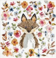 A whimsical Design Works counted cross-stitch kit titled 'Watercolour Fox.' The design features a stylized fox with reddish-brown fur and a white chest, surrounded by a circular border of flowers in vibrant, watercolour-style shades of pink, teal, and orange. The kit is shown with 14-count white Aida fabric, a pre-sorted thread palette, and a needle