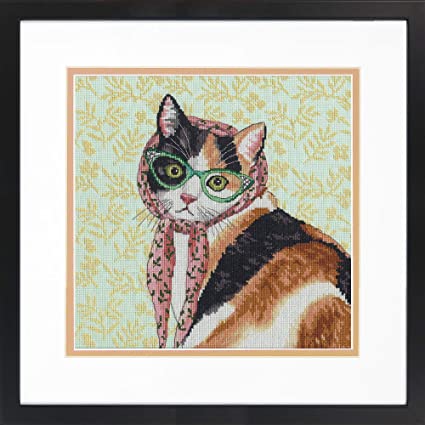 A cross stitch kit depiction of a cat wearing sunglasses and a pink scarf, with a green floral background.