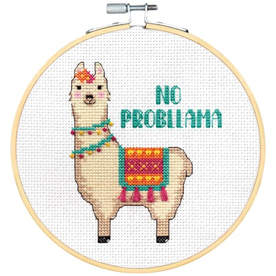 A vibrant and funny Dimensions counted cross-stitch kit titled 'No Probllama.' The design features a white llama wearing a colorful, tasseled blanket and the pun 'No Probllama' in a playful font. The kit includes 14-count white Aida fabric, a 6-inch bamboo embroidery hoop, pre-sorted thread, and a needle