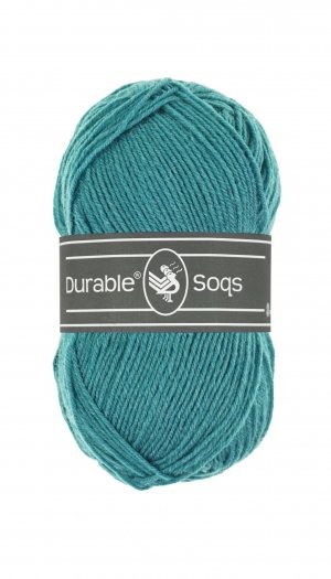 A 50g ball of Durable Soqs yarn, showing the fine, multi-ply wool and polyamide blend designed for long-lasting, durable socks in Caribbean sea blue olour