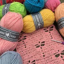 Close-up of Durable Soqs yarn, showcasing the smooth, tight twist and even strand thickness that provides excellent stitch definition for cables and ribbing