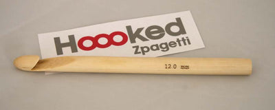 Singapore crochet supplies.
Packaged DMC Hoooked Zpagetti Wooden Crochet Hook, beige in color, displayed in a clear plastic case with a white background.
"A large, professional-grade DMC Hoooked Zpagetti crochet hook made from smooth, light-grained natural wood.