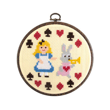 Olympus Japan Alice in Wonderland cross-stitch kit packaging featuring Alice and whimsical motifs with a 6-inch blue embroidery hoop