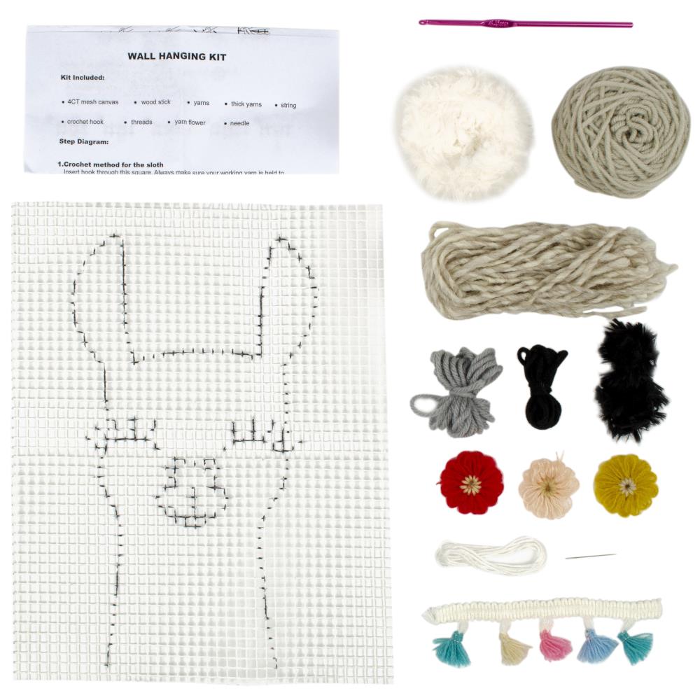 A flat lay of the Llama Crochet Kit including the printed mesh, 4.5mm hook, fluffy fur yarn, and colorful embroidery floss