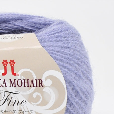 A 25g ball of Hamanaka Alpaca Mohair Fine yarn, showcasing its soft, fuzzy halo and fine, delicate strand. The image highlights the airy texture created by the blend of goat mohair and high-grade alpaca, perfect for knitting or crocheting lightweight, fluffy wearables like scarves, vests, and cardigans in light blue