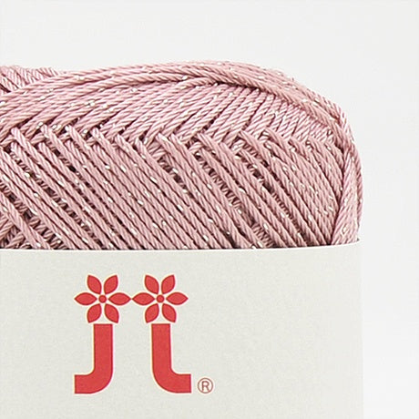 A 30g ball of Hamanaka Aprico Lame yarn made in Japan, showing the fine cotton strand entwined with a subtle metallic shimmer for a sophisticated sparkle in ballet pink colour