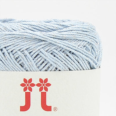 A 30g ball of Hamanaka Aprico Lame yarn made in Japan, showing the fine cotton strand entwined with a subtle metallic shimmer for a sophisticated sparkle baby blue