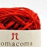 A compact ball of premium Japanese COMA COMA jute yarn, highlighting the consistent thickness and rich color saturation of the natural fibers in Red