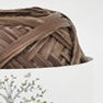 A vibrant selection of Hamanaka Eco Andaria yarn cakes in various summer colors, made in Japan in dark brown bark colour