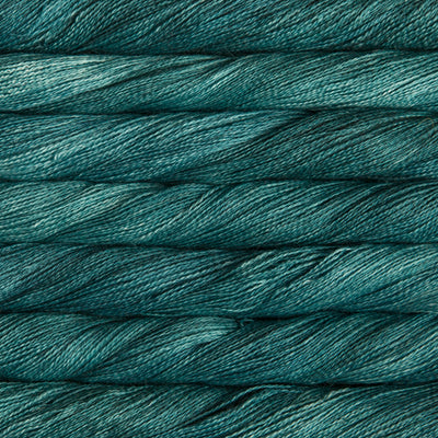 Hand-Dyed Lace Weight Yarn, Luxury Silk Knitting Fiber, Malabrigo Singapore.
A 50g skein of Malabrigo Silpaca yarn, showcasing its signature hand-dyed variegation and the luminous sheen of the silk-alpaca blend in teal feather colour