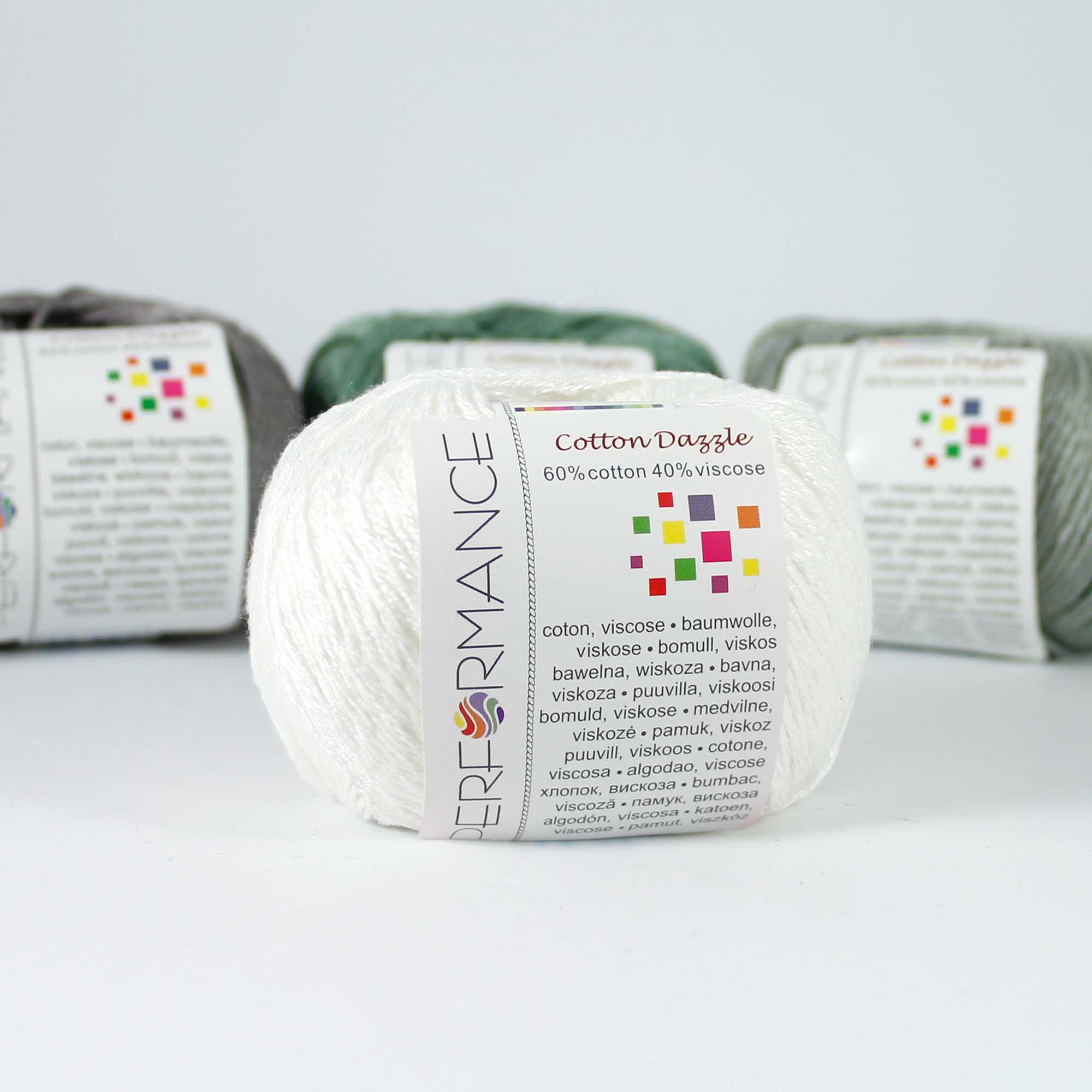 A 50g skein of Cotton Dazzle yarn in a vibrant shade, showcasing the subtle reflective shimmer and smooth plied texture of the cotton-viscose blend in white colour