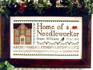 A professional cross-stitch chart for a traditional-style sampler titled 'Home of a Needleworker.' The high-definition design features the central motto in elegant typography, accompanied by classic needlework motifs like houses, birds, and decorative borders