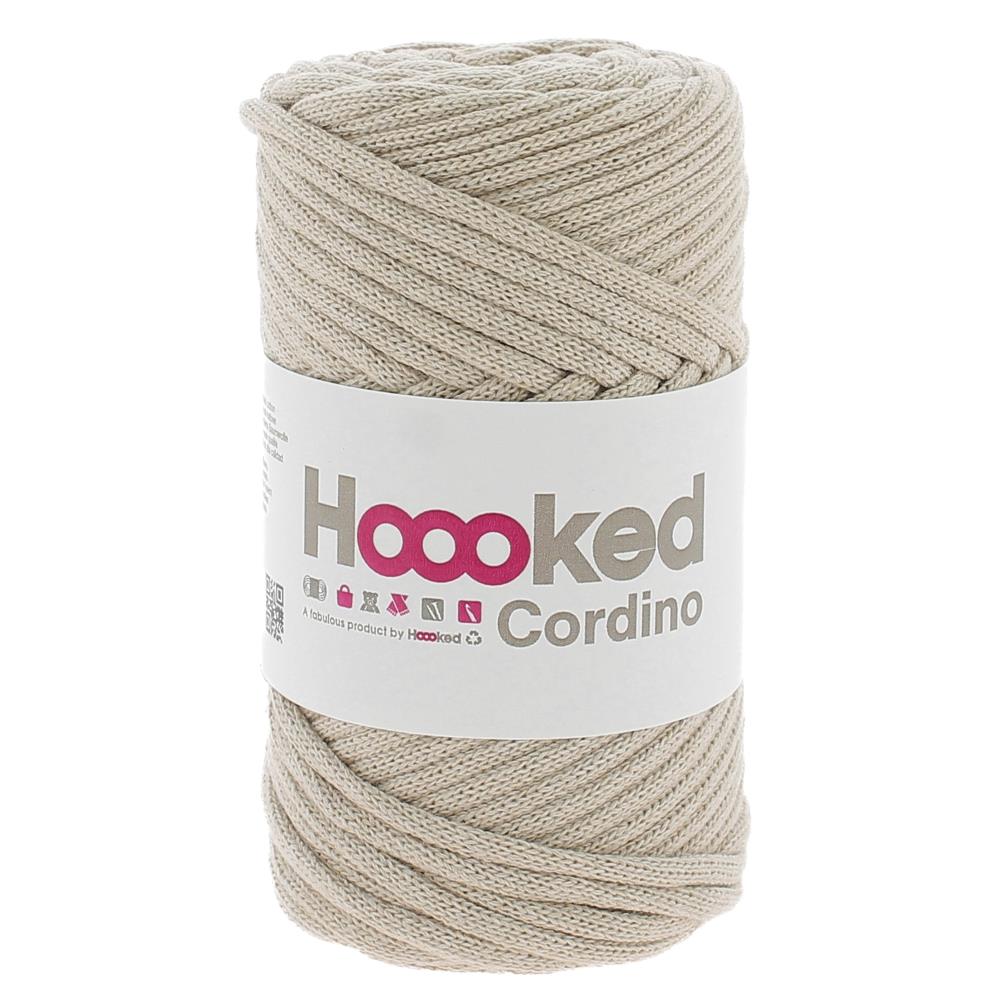 A spool of Hoooked Cordino highlighting the dense, non-stretch braided strand and the natural, matte appearance of its recycled textile fibers in Sandy Ecru colour