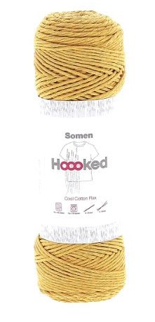A 100g ball of Hoooked Somen yarn, showing its beautiful matte texture and the subtle, natural variations of the cotton-linen blend in oro yellow colour