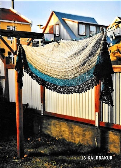 An interior gallery showing a shawl knitted with of Lopi yarn put on a clothsline