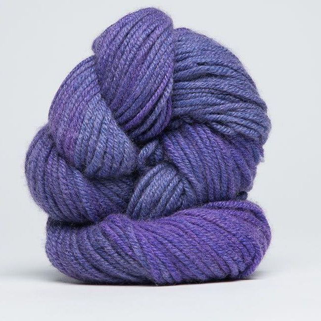 A delicate skein of hand-dyed Jade Sapphire yarn, showcasing a sophisticated blend of 55% silk and 45% cashmere in Hydranea colours
