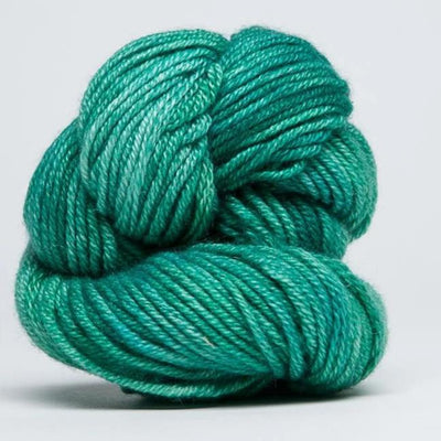 "A delicate skein of hand-dyed Jade Sapphire yarn, showcasing a sophisticated blend of 55% silk and 45% cashmere in Jade Green Colour