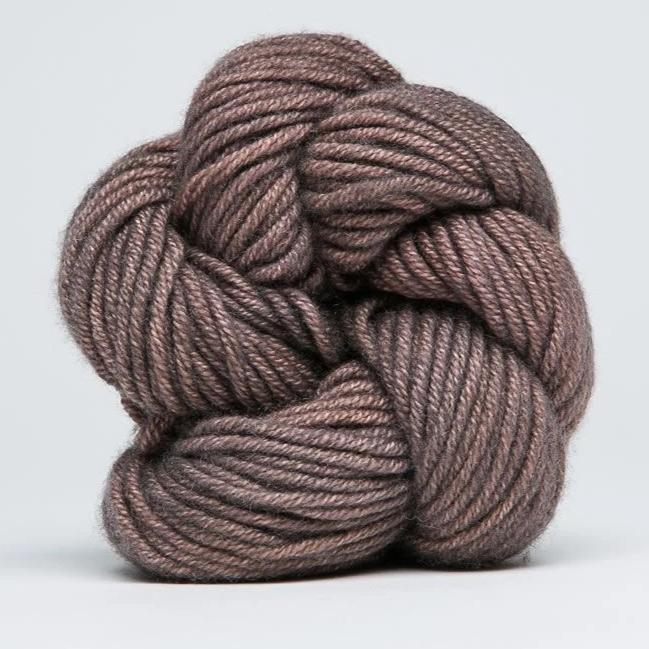 "A delicate skein of hand-dyed Jade Sapphire yarn, showcasing a sophisticated blend of 55% silk and 45% cashmere in Tea Leaves colours