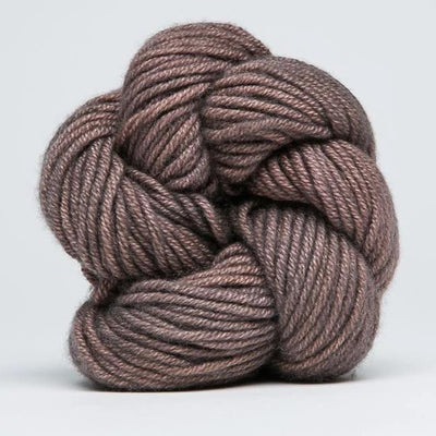 "A delicate skein of hand-dyed Jade Sapphire yarn, showcasing a sophisticated blend of 55% silk and 45% cashmere in Tea Leaves colours