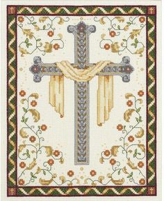 Cross stitch kit depicting a white cross on a cream-colored fabric with green, blue, and gold accents, and floral patterns around it.